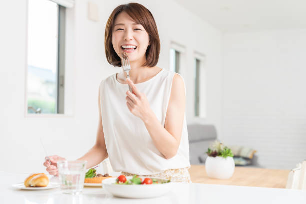 attractive asian woman who eats