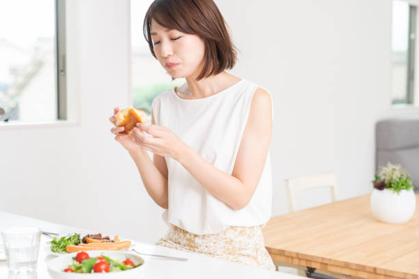 istock attractive asian woman who eats 1353913832