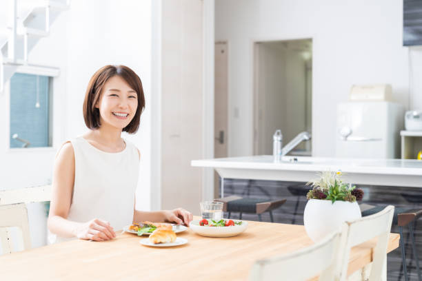 istock attractive asian woman who eats 1353914346