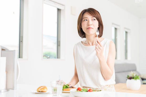 istock attractive asian woman who eats 1353914379