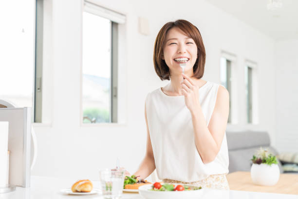 istock attractive asian woman who eats 1353914386