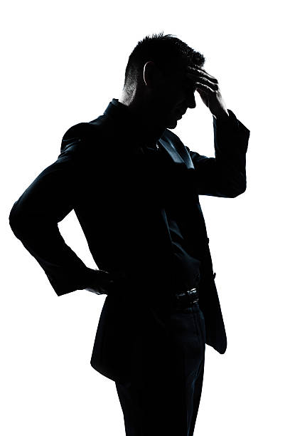 istock silhouette man portrait tired migraine backache 135391776