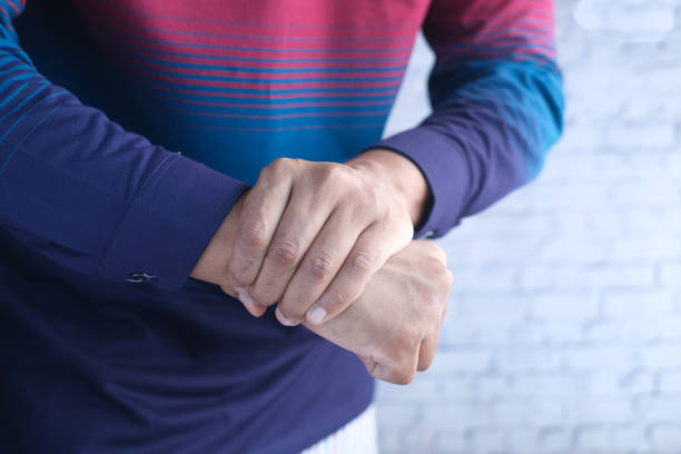 istock man suffering pain in hand close up 1353918501