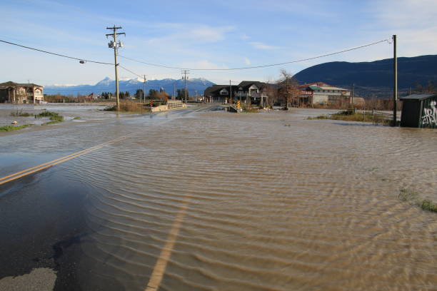 Flooding of #3 road in Abbotsford British Columbia Looking to the south from the Trans-Canada highway . The #3 Road in Abbotsford British Columbia is covered in water after heavy rain fall causes serious flooding of the Fraser Valley. Taken Nov 17 2021 abbotsford canada stock pictures, royalty-free photos & images