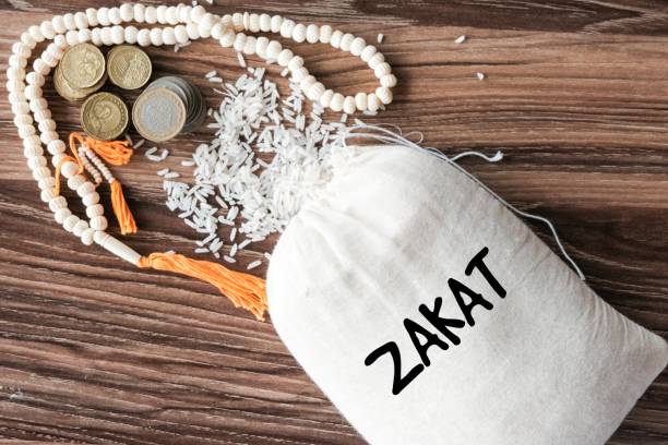 Giving zakat Zakat for the poor alms stock pictures, royalty-free photos & images