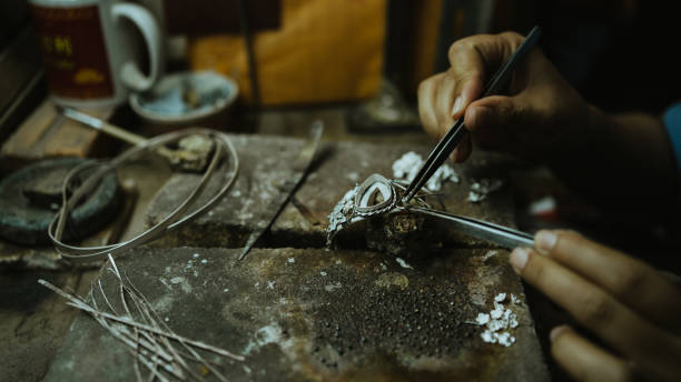 jeweler at work in jewelry. desktop for craft jewelry making with professional tools. close up view of tools. silver jewelry. - luxury craft imagens e fotografias de stock