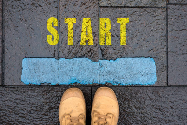 istock message in the road with feet - Start 1353930706