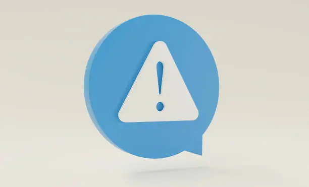 Photo of Triangular alert caution sign inside round chat bubble.