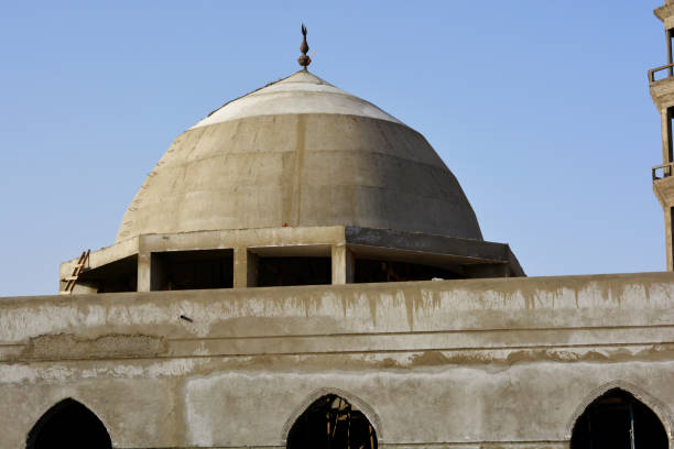 istock A new mosque under construction against the sunny blue sky, building a new mosque with its big dome in cement 1353930836