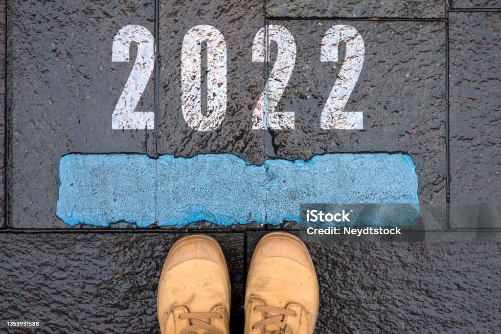 message in the road with feet - 2022 concept message in the road with feet - 2022 2022 Stock Photo