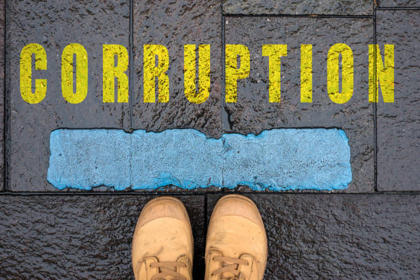istock message in the road with feet - corruption 1353931881