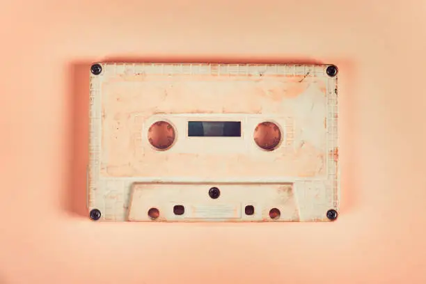 Toned Photo of the Old Audio Cassettes on the Paper Background closeup
