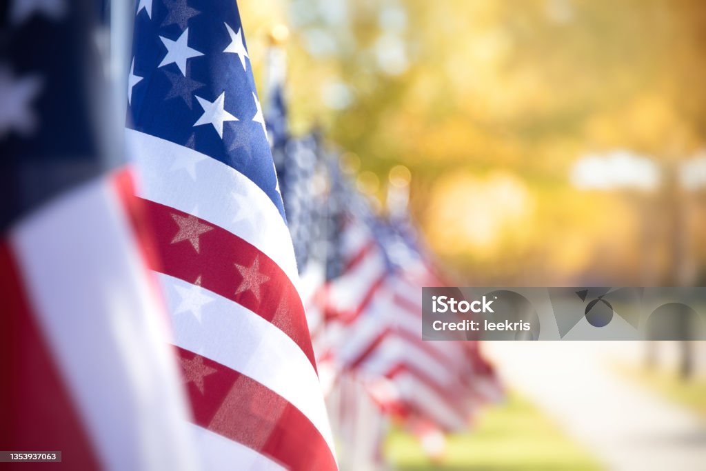 Closeup of an American flag in a row Closeup of an American flag in a row. Memorial day, Independence day, Veterans day, patriotic concept. Copy space. US Veteran's Day Stock Photo