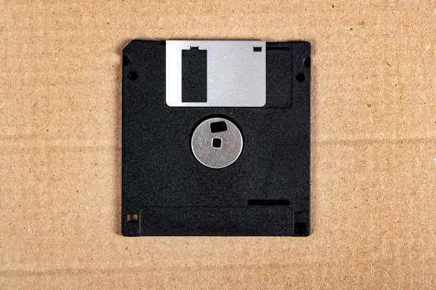 Floppy Disk Drive on the Cardboard Background closeup