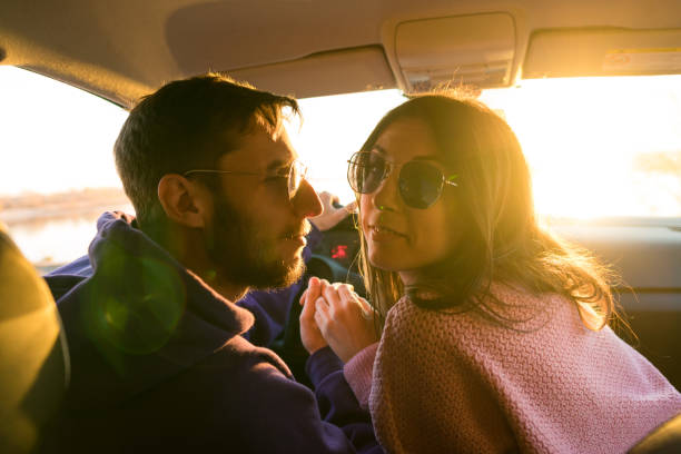 istock Couple Inside Car Together 1353946906