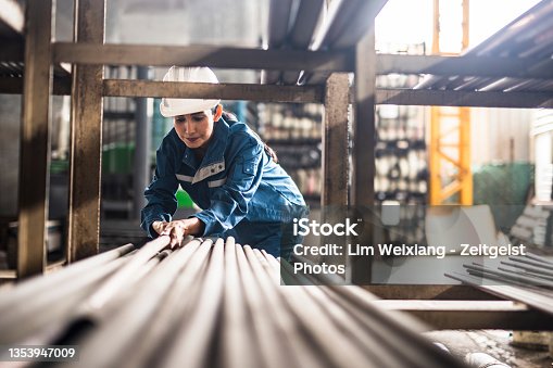 istock Female Steel Factory Worker at work 1353947009