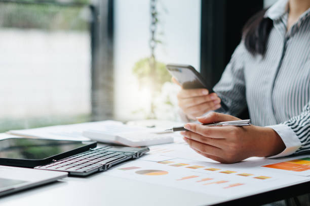 istock strategy analysis concept, Businessman working financial Manager Researching Process accounting calculate analyse market graph data stock information review on the table in office. 1353947131