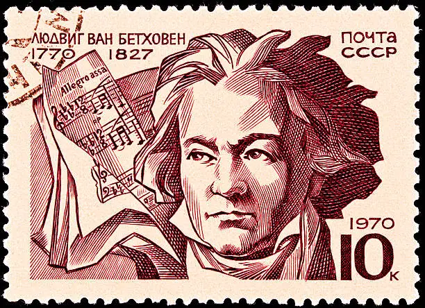 USSR- CIRCA 1970:  A stamp printed in the USSR shows a portrait of Ludwig Von Beethoven and a score marked Allegro Assai, circa 1970.