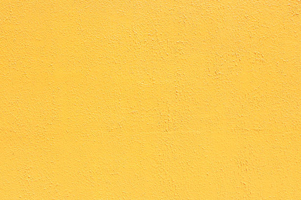 istock Saturated yellow low contrast Concrete textured background 1353948655