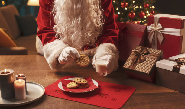 istock Santa Claus having a delicious snack 1353952649