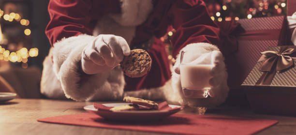 istock Santa Claus having a delicious snack 1353952752
