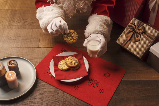 istock Santa Claus having a delicious snack 1353953040