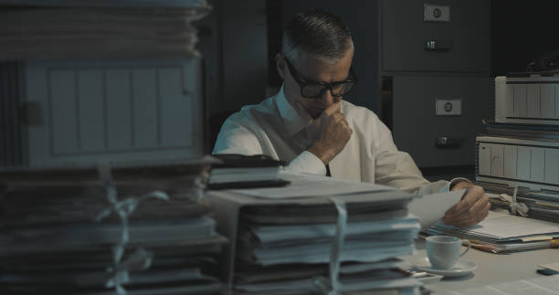 istock Businessman working late at night 1353953967