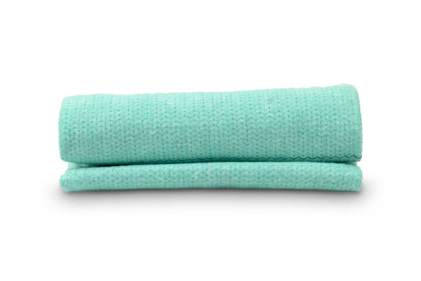istock blue towel rolled up in a tube, white background 1353954554