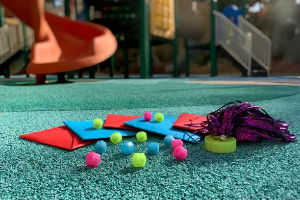 Photo of Korean traditional outdoor game tools on the playground. Gonggi, Ttakji and Jegi.