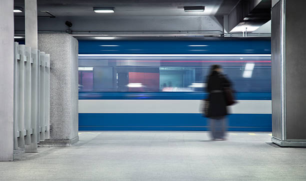 Waiting the metro Someone waiting the metro. A long exposure of the wagon that show the movements and a blurry person just standing there. montreal underground city stock pictures, royalty-free photos & images