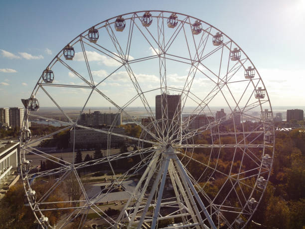istock Ferris wheel against blue sky 1353963736