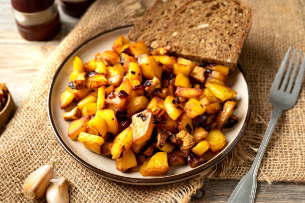 istock Fried potatoes in a plate on a gray wooden table closeup 1353964431