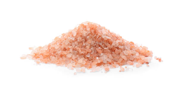 istock Pile of pink himalayan salt isolated on white 1353966471
