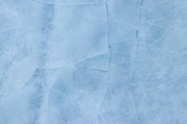 istock Texture of the cracked ice. Winter background 1353967046