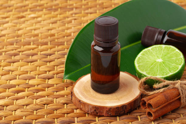 istock Bottle of essential oil and green leaf 1353967343