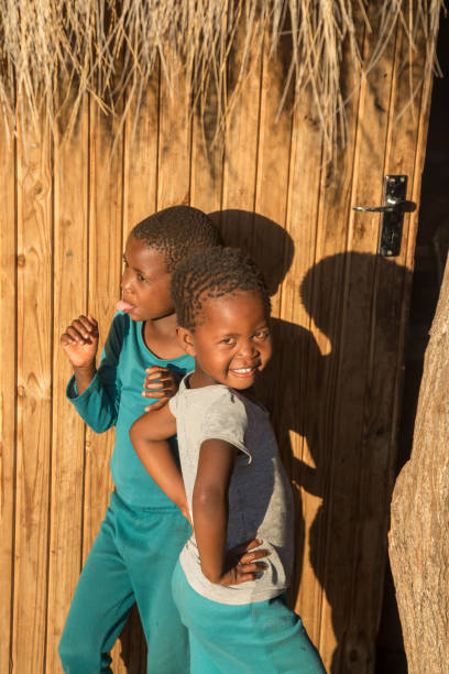 istock African village two happy children playing 1353967478