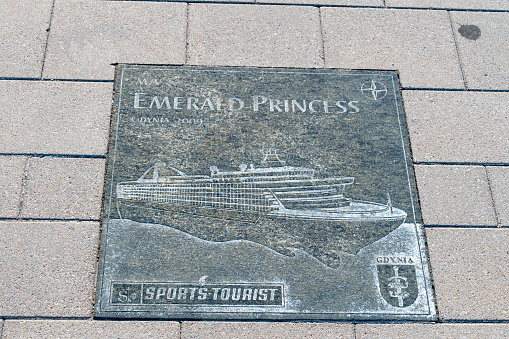Gdynia, Poland - August 1, 2021: Plaque of Emerald Princess at Passenger Ships Alley visiting Gdynia.