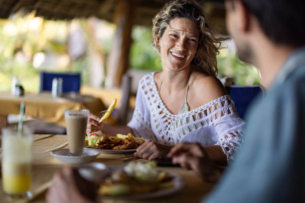 istock Happy couple communicating while being on a lunch in a restaurant. 1353968580