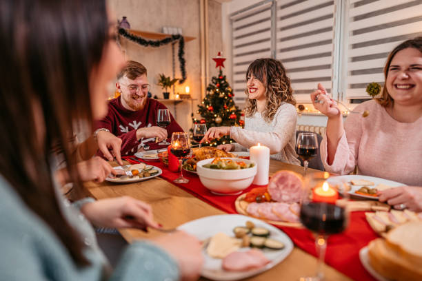 istock Friends having Christmas dinner together 1353968660