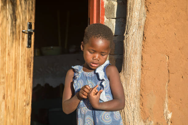 istock shy African small girl 1353969482