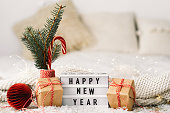 istock Happy New Year. New Year background with presents, garlands and New Year decorations. 1353969931