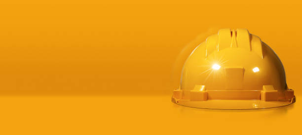 istock Orange Hard Hat or Safety Helmet on Yellow Background 1353972062