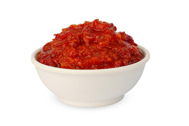 istock ketchup or tomato sauce in white bowl, isolated on white 1353972167