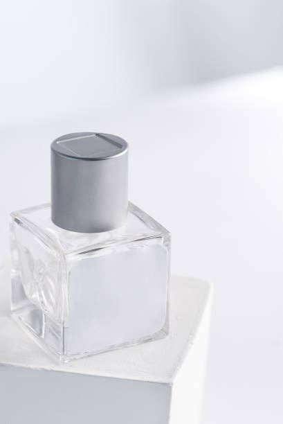 istock glass product package aroma perfume bottle on stand with sunlight, 1353977382