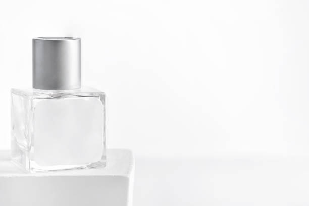 istock glass product package aroma perfume bottle on stand with sunlight, 1353977394