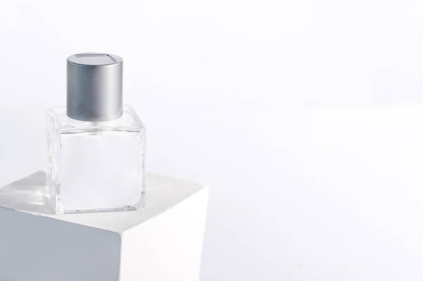 istock glass product package aroma perfume bottle on stand with sunlight, 1353977450