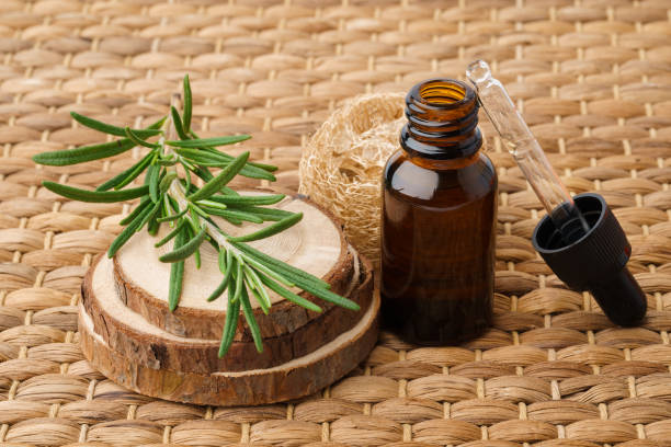 istock Bottle with essential oil on wooden background 1353978209