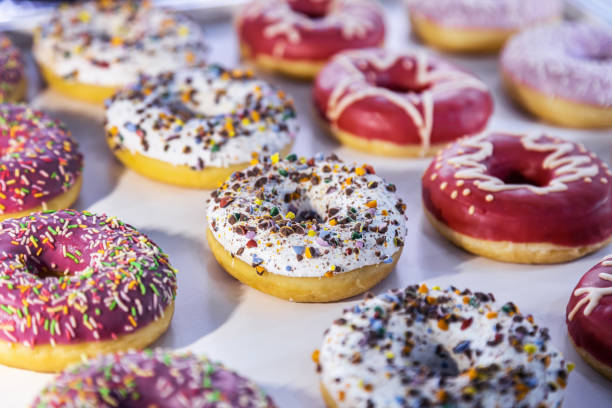 istock donuts with different flavors, fillings and different sprinkles 1353979899