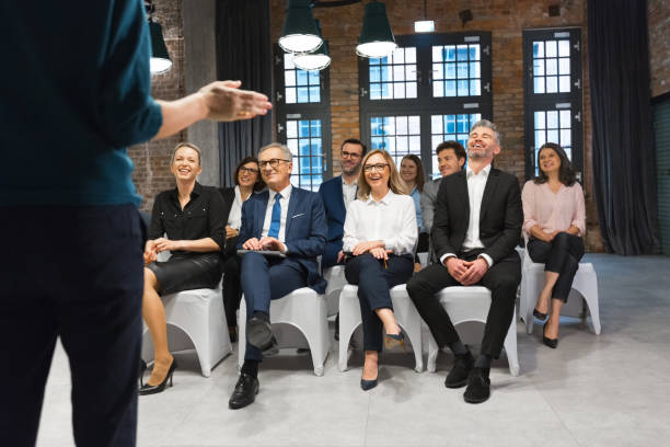 istock Cheerful audience during business seminar 1353981141