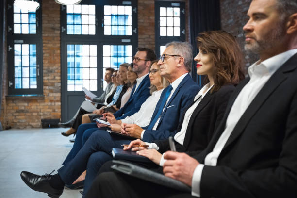 istock Entrepreneurs on business seminar 1353981829
